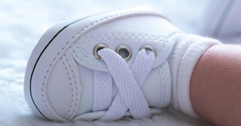 A tiny baby shoe representing the Hungarian adoption process and the hope of becoming a parent